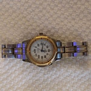 GUC Guess waterproof silver and gold chain link watch.